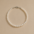 Lulu Bracelet by Ryã Atelier featuring petite 4mm freshwater pearls with sterling silver clasp. 