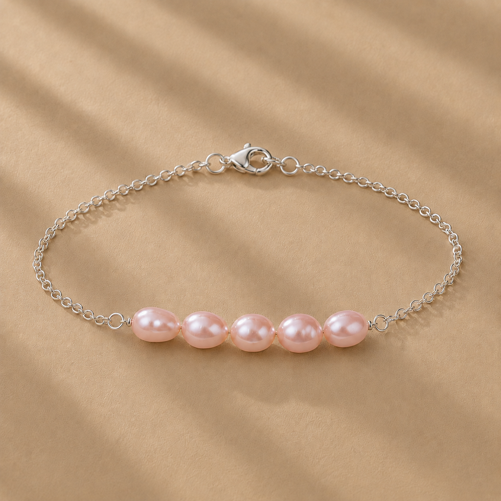 The Vivienne Bracelet by Ryã Atelier, featuring five natural pink-toned freshwater pearls on a delicate 925 sterling silver chain. Individually made in South Africa.