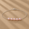 The Vivienne Bracelet by Ryã Atelier, featuring five natural pink-toned freshwater pearls on a delicate 925 sterling silver chain. Individually made in South Africa.