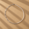 The Ayanda Necklace by Ryā Atelier features a solid sterling silver handmade paperclip chain and a string of delicate freshwater pearls. 