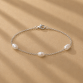The Nubia freshwater pearl bracelet with three natural pearls on a delicate sterling silver chain by Ryã Atelier