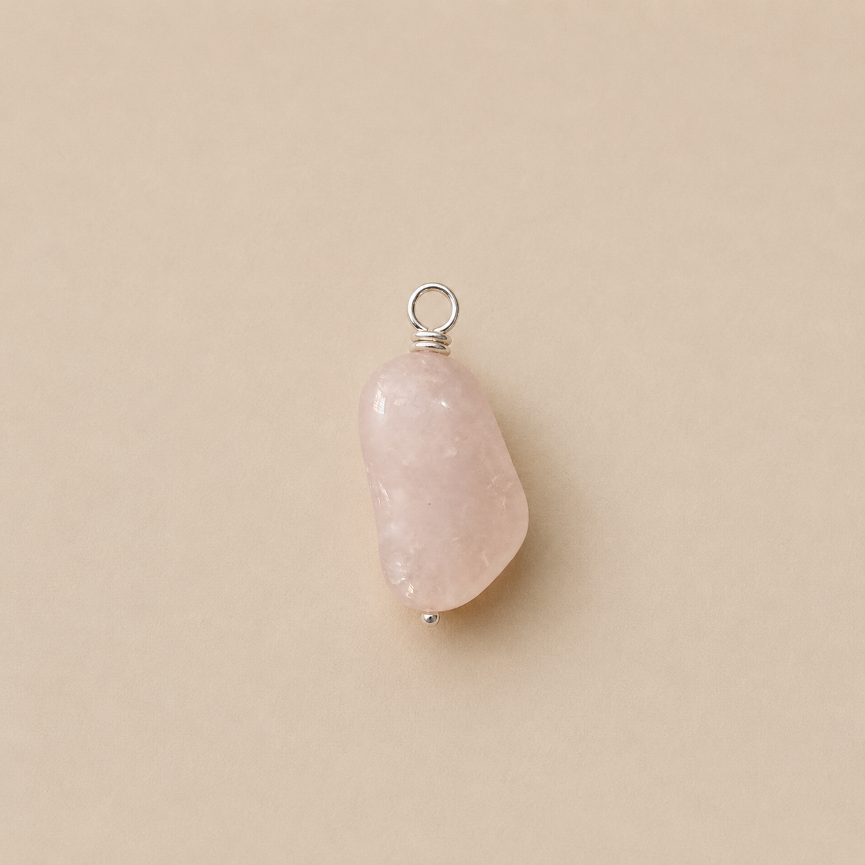Rosa Pendant, from Rya Atelier, handcrafted from a natural Rose Quartz drop bead with a sterling silver ball head pin and round pendant loop. 