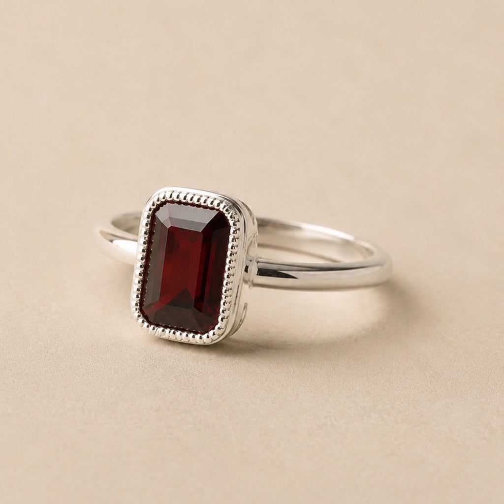 Amahle Ring handcrafted in solid 925 sterling silver featuring a natural emerald cut garnet in a bezel setting by Ryã Atelier.