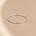 Asanda Thin Ring handcrafted in solid 925 sterling silver featuring a minimalist hand-hammered faceted stacking band by Ryã Atelier.