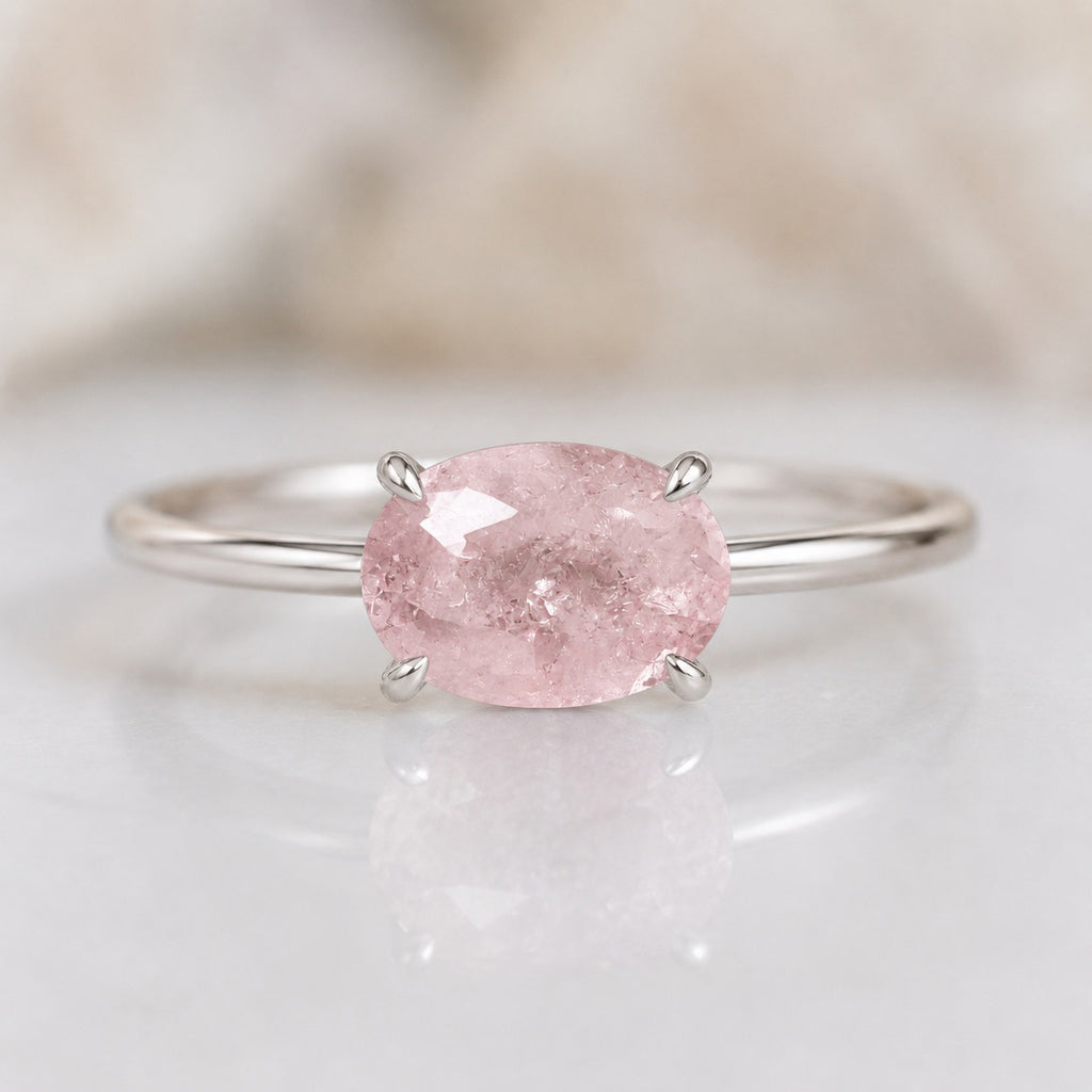 Aurora Ring handcrafted in solid 925 sterling silver featuring a natural oval pink morganite in a four-claw solitaire setting by Ryã Atelier close up. 