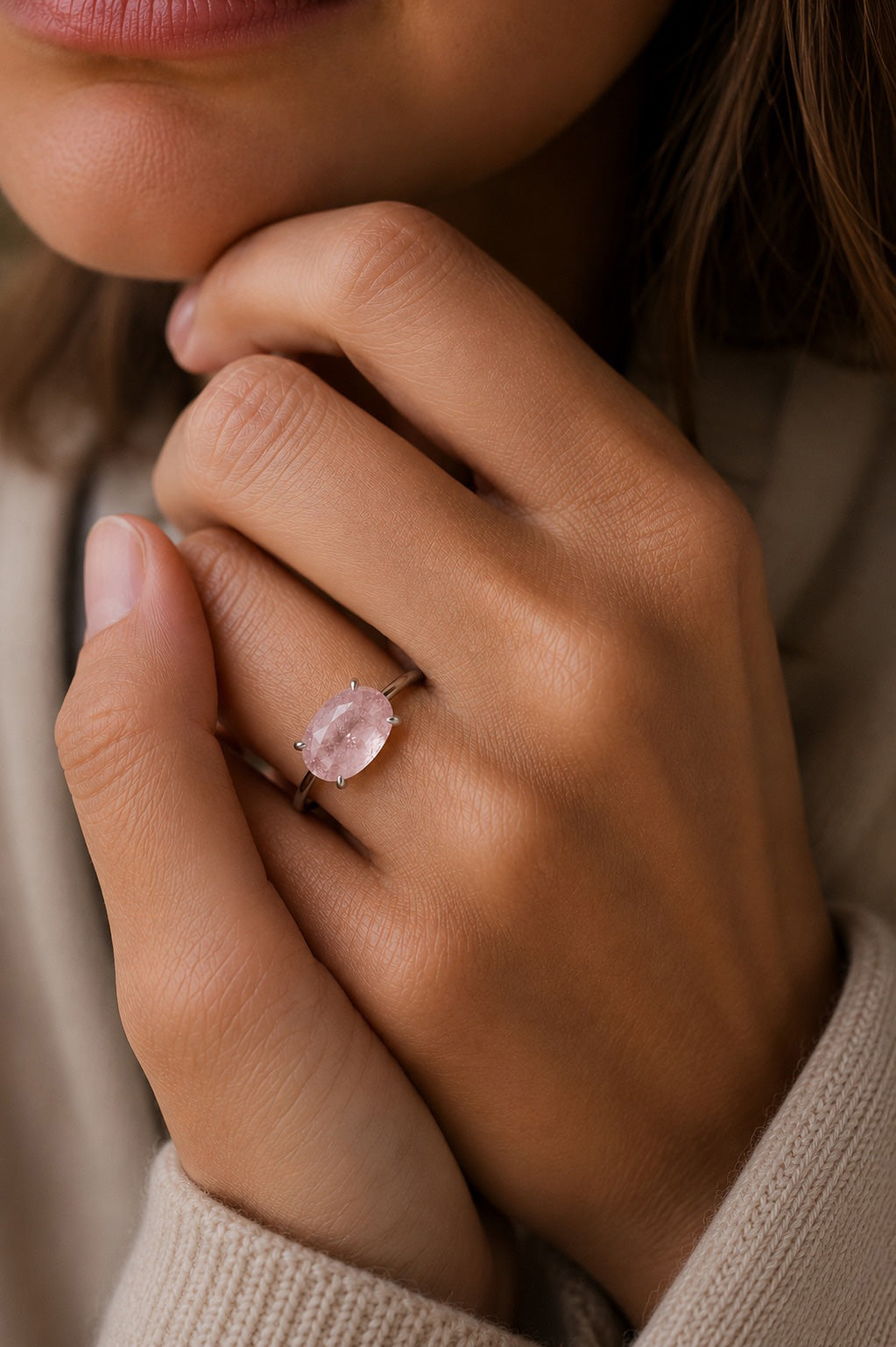Close up of model wearing the Aurora Ring handcrafted in solid 925 sterling silver with a natural oval pink morganite by Ryã Atelier.