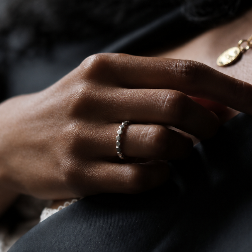 close up of hand with Emihle Ring handcrafted in solid 925 sterling silver with an organic pebble design by Ryã Atelier.