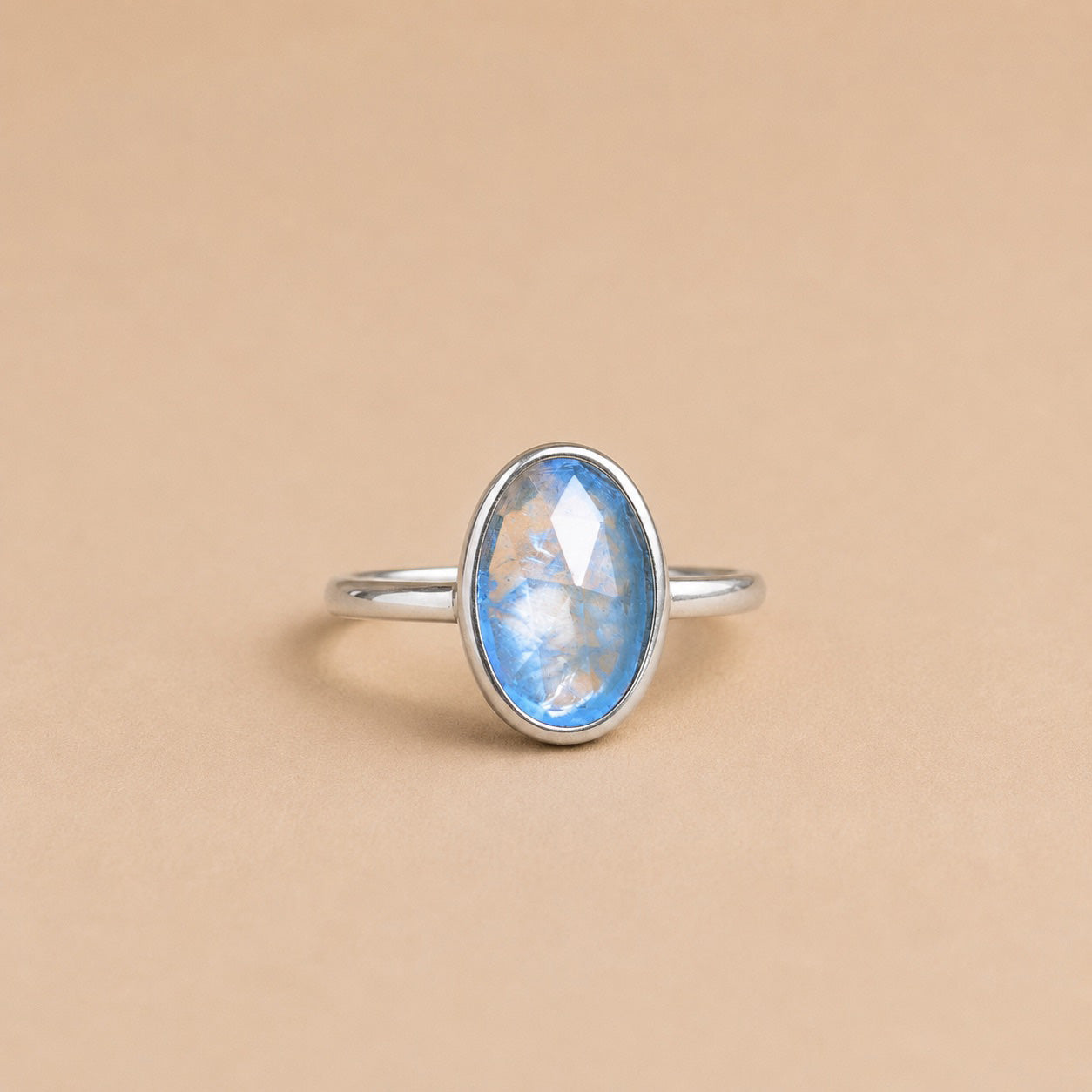 Imka Ring handcrafted in solid 925 sterling silver featuring a natural oval blue aquamarine in a bezel setting by Ryã Atelier.