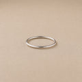 The Lesedi Ring Handcrafted in solid 925 sterling Silver with beige background