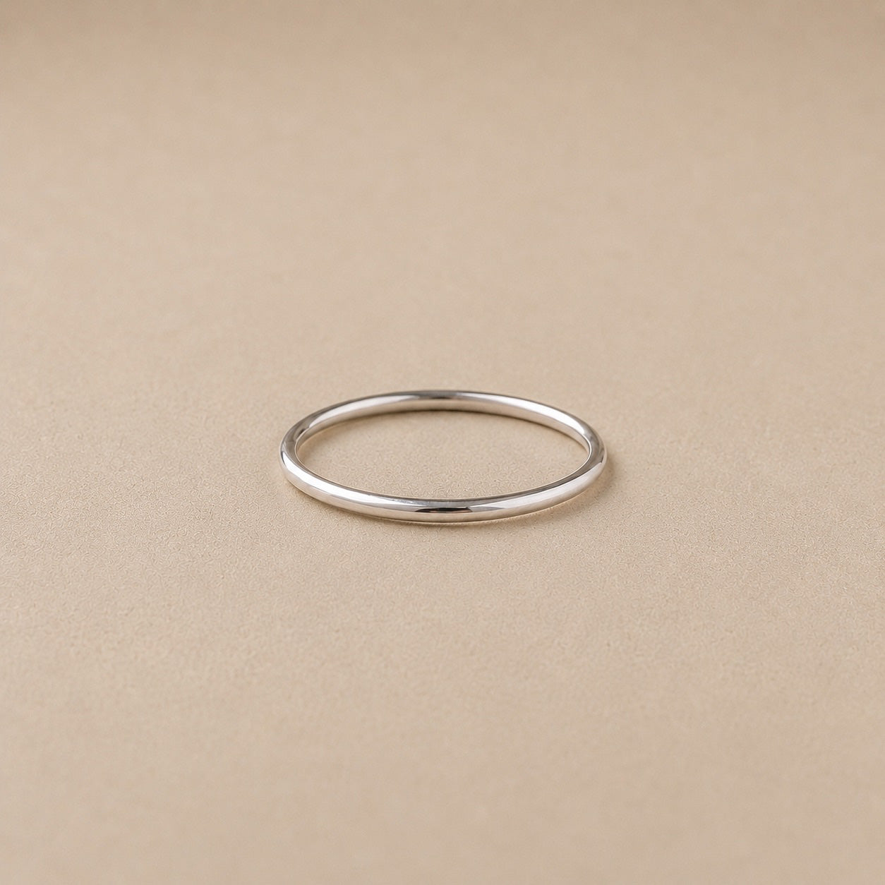 The Lesedi Ring Handcrafted in solid 925 sterling Silver with beige background