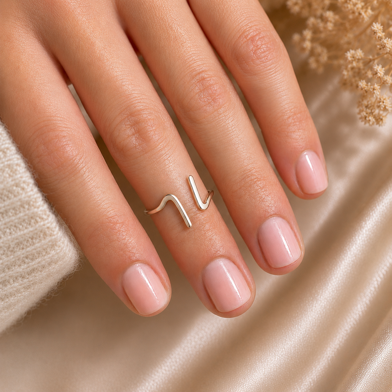 Model wearing the Lila Ring handcrafted in solid 925 sterling silver with a contemporary organic wave design by Ryã Atelier.