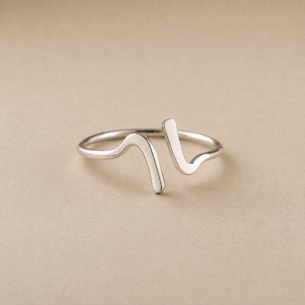 Lila Ring handcrafted in solid 925 sterling silver featuring a minimalist sculptural wave design by Ryã Atelier.
