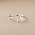 Lila Ring handcrafted in solid 925 sterling silver featuring a minimalist sculptural wave design by Ryã Atelier.