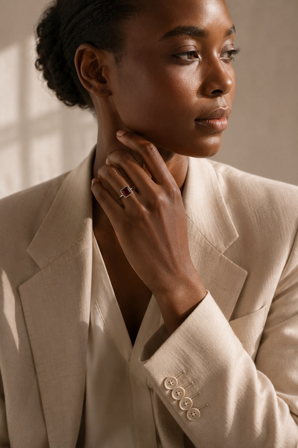 Model wearing the Oratile Ring handcrafted in solid 925 sterling silver with a natural square cabochon garnet by Ryã Atelier.
