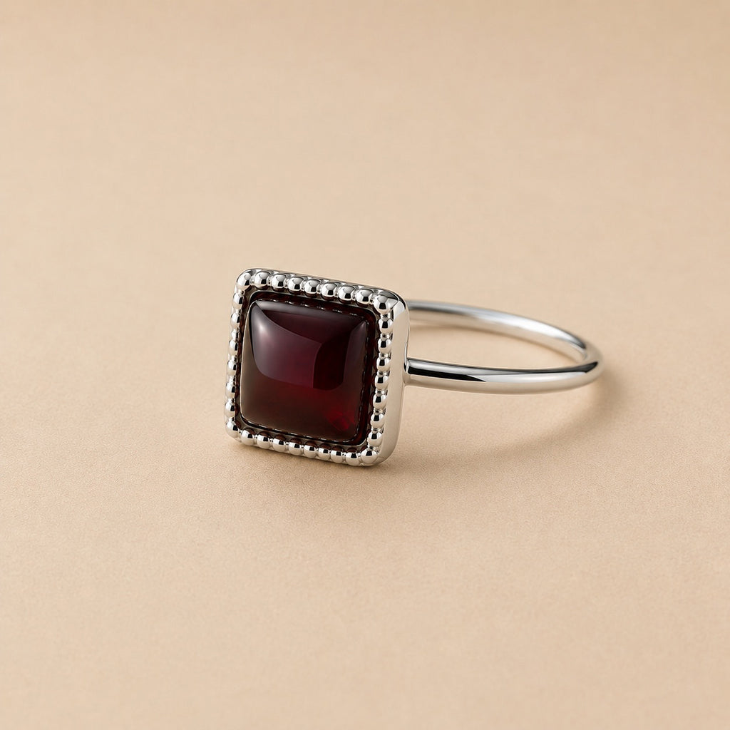 Oratile Ring handcrafted in solid 925 sterling silver featuring a natural square cabochon garnet with a beaded bezel setting by Ryã Atelier.