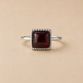 Oratile Ring handcrafted in solid 925 sterling silver featuring a natural square cabochon garnet with a beaded bezel setting by Ryã Atelier.