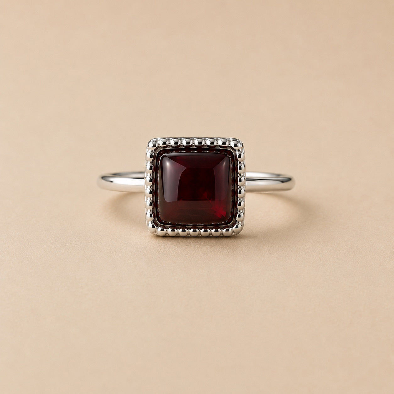 Oratile Ring handcrafted in solid 925 sterling silver featuring a natural square cabochon garnet with a beaded bezel setting by Ryã Atelier.