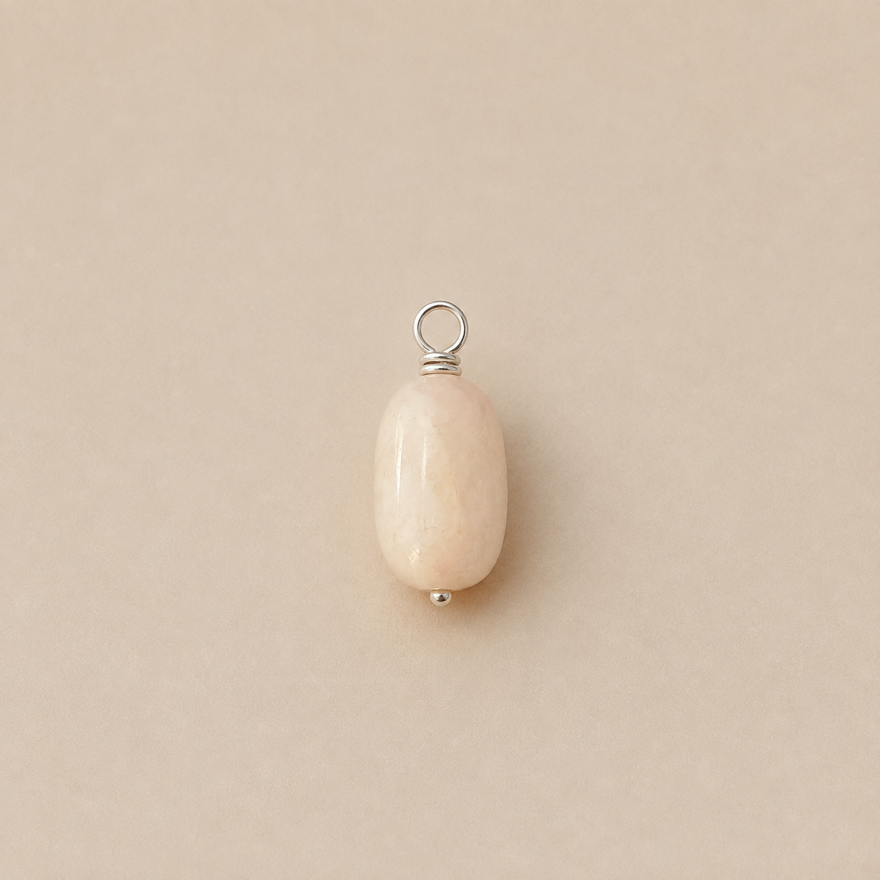 Rosa Pendant, from Rya Atelier, handcrafted from a natural Rose Quartz drop bead with a sterling silver ball head pin and round pendant loop. 