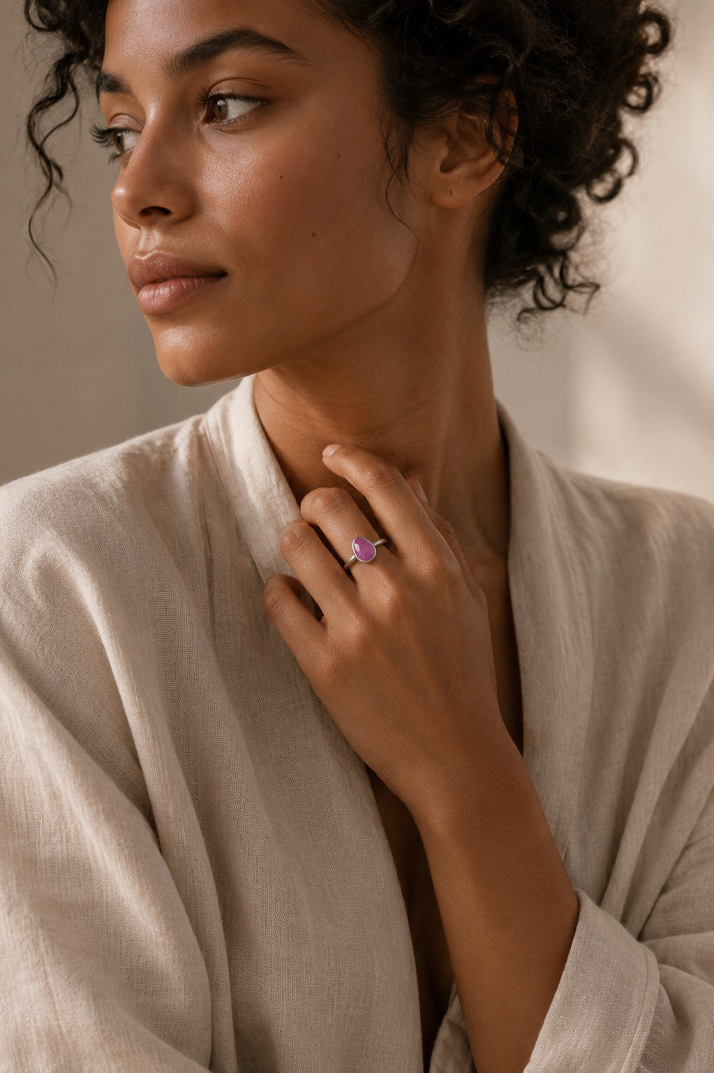 Model wearing the Thabisa Ring handcrafted in solid 925 sterling silver with a natural pear cut pink ruby by Ryã Atelier.