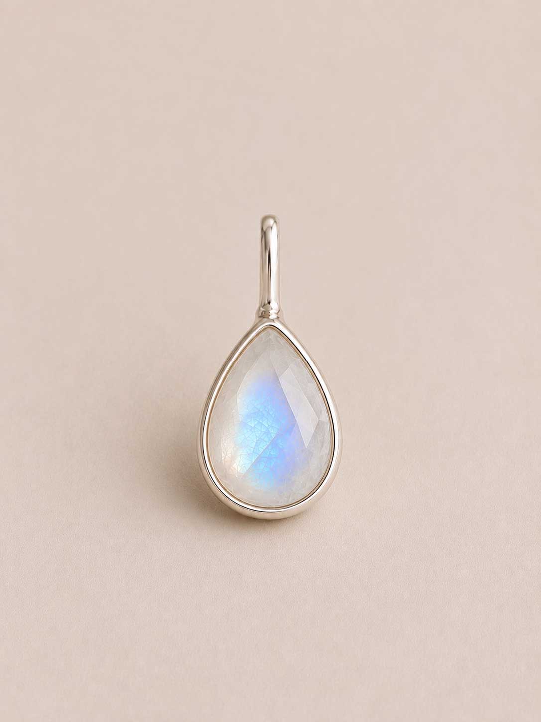 Droplet/teardrop shaped Unyezi Moonstone pendant by Rya Atelier. Faceted Rainbow Moonstone set in solid 925 sterling silver. 
