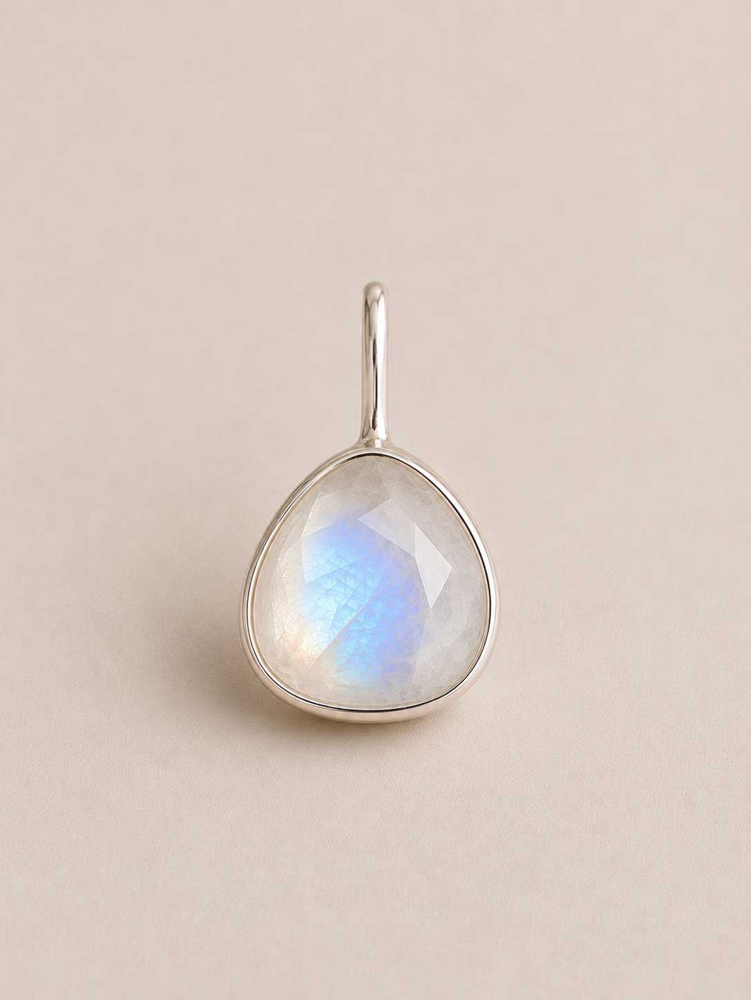 Pebble shaped Unyezi Moonstone pendant by Rya Atelier. Faceted Rainbow Moonstone set in solid 925 sterling silver. 