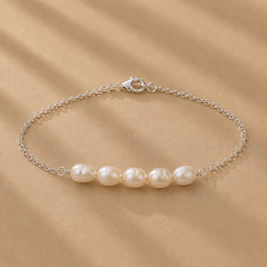 Vivienne Bracelet featuring five white freshwater pearls on a delicate sterling silver chain by Ryã Atelier