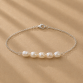 Vivienne Bracelet featuring five white freshwater pearls on a delicate sterling silver chain by Ryã Atelier