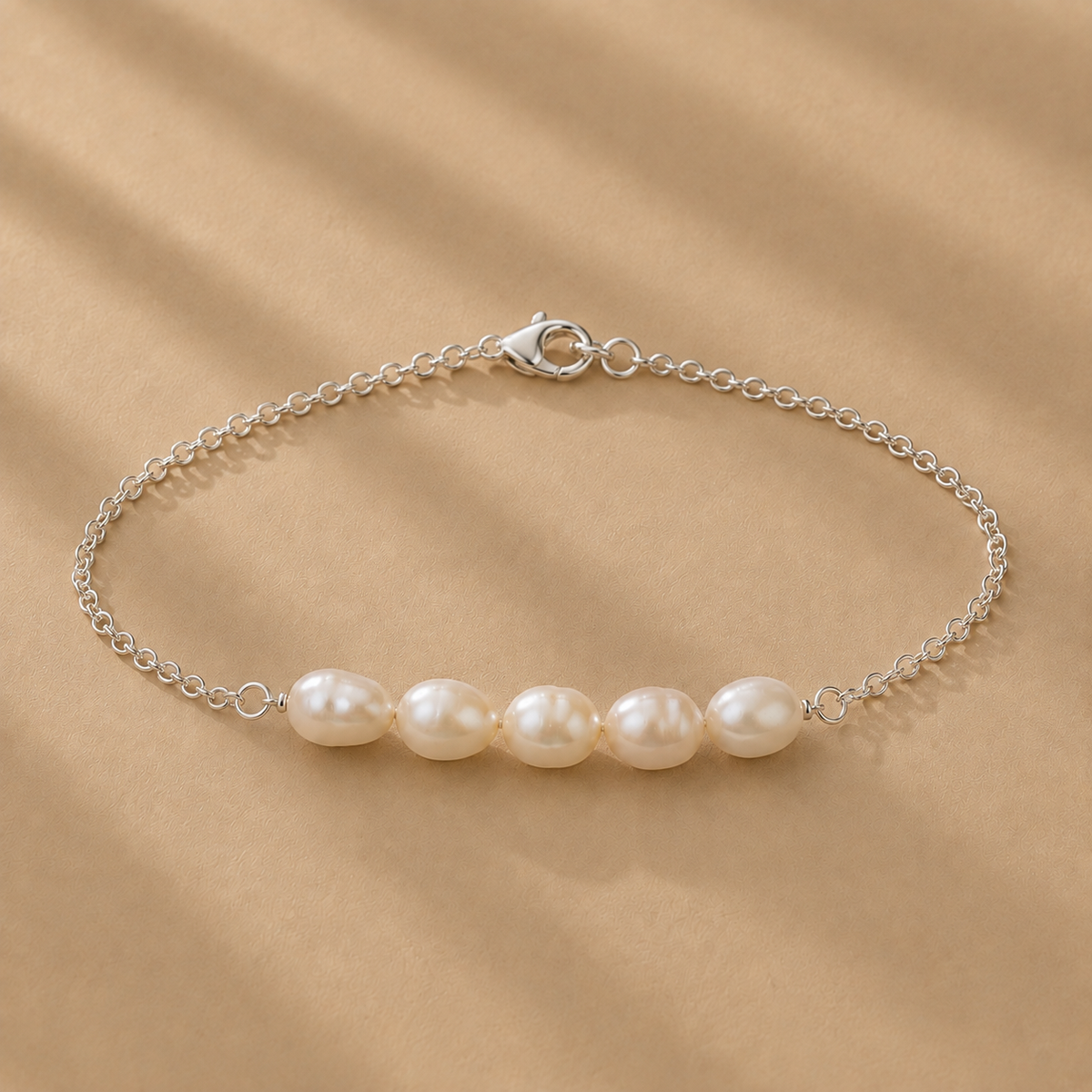 Vivienne Bracelet featuring five white freshwater pearls on a delicate sterling silver chain by Ryã Atelier