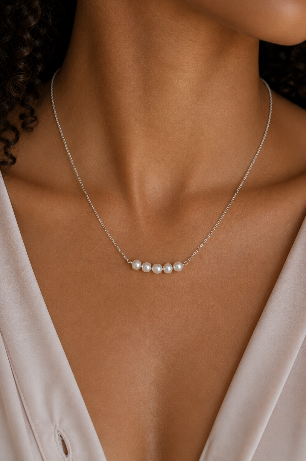 Model wearing the Ryã Atelier Vivienne White Pearl Necklace featuring five 5mm freshwater pearls on a fine sterling silver chain