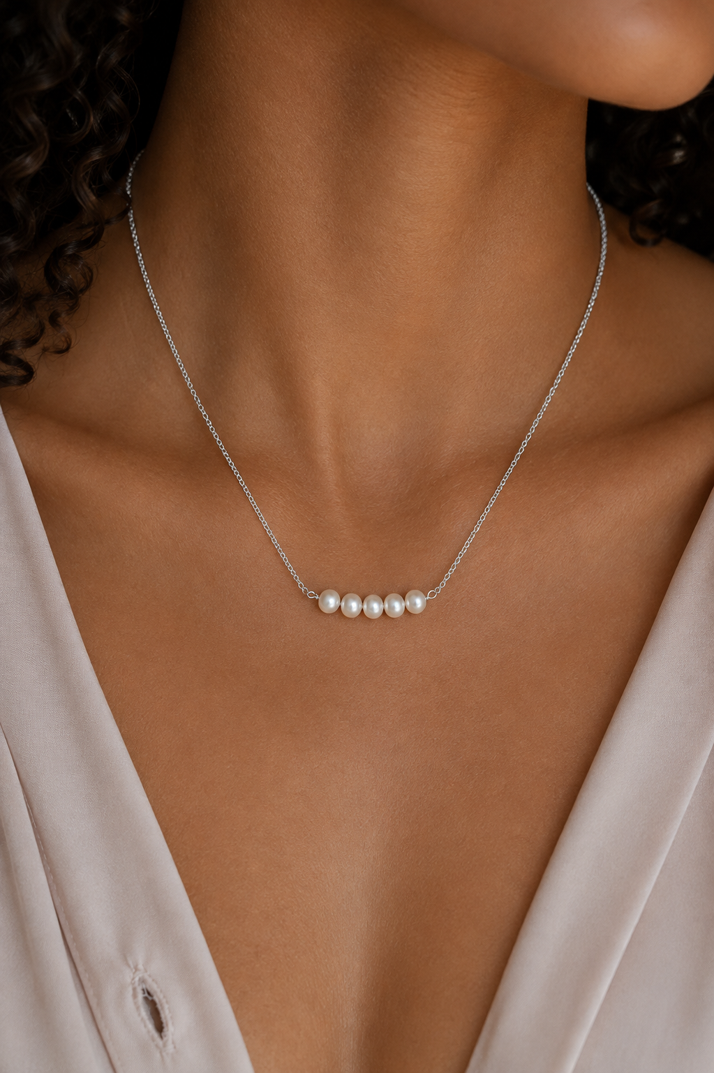 Model wearing the Ryã Atelier Vivienne White Pearl Necklace featuring five 5mm freshwater pearls on a fine sterling silver chain