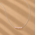 Vivienne Pink Pearl Necklace by Ryã Atelier featuring five Pink-toned 5mm freshwater pearls on a fine sterling silver chain
